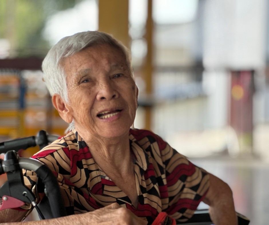Smiling senior resident at Amitabha Foundation Elder Home
