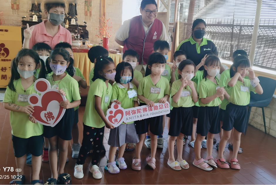 Children and volunteers visiting Amitabha Foundation Elder Home